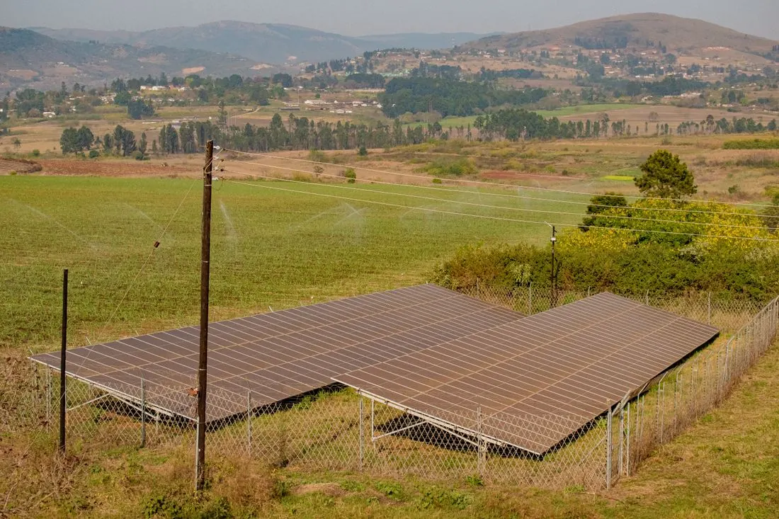 Ground-mounted solar panels on a rural farm